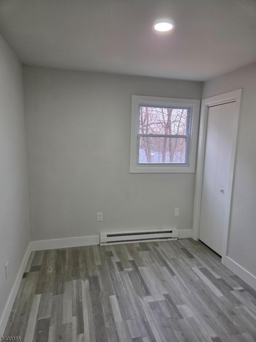 441 Rutherford Avenue Franklin, NJ 07416 - Photo 6 of 7 wooden floor in an empty room with a window