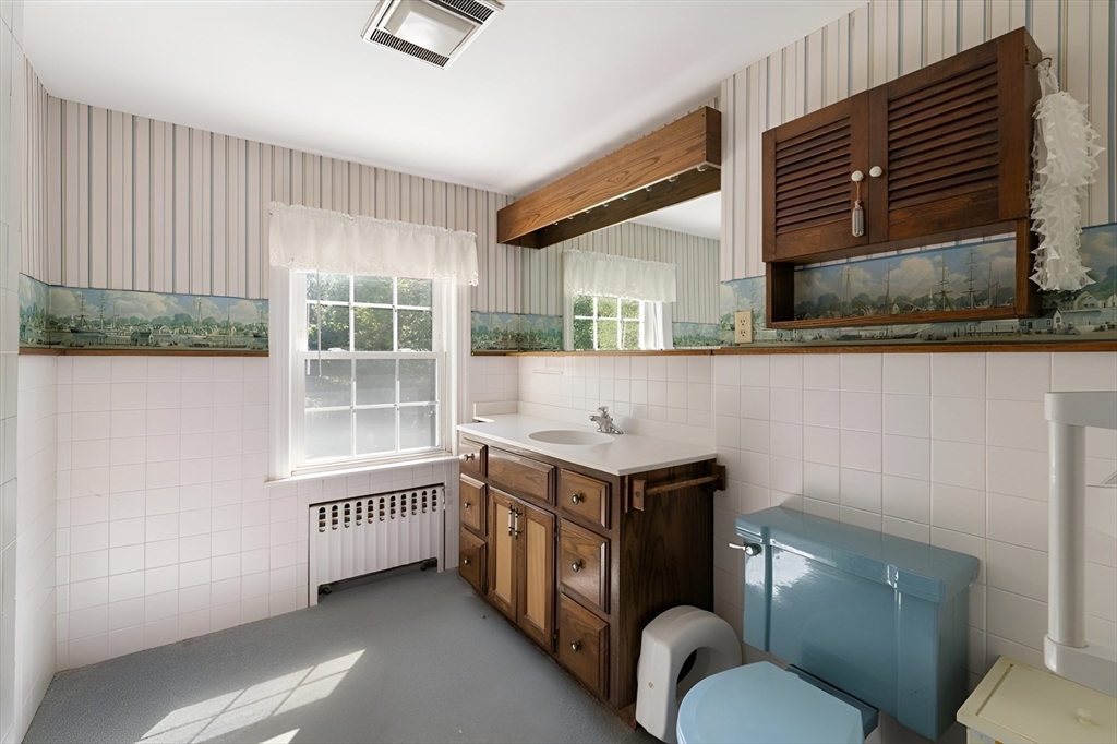 751 Brook Road Milton, MA 02186 - Photo 13 of 20 a bathroom with a sink a toilet and shower