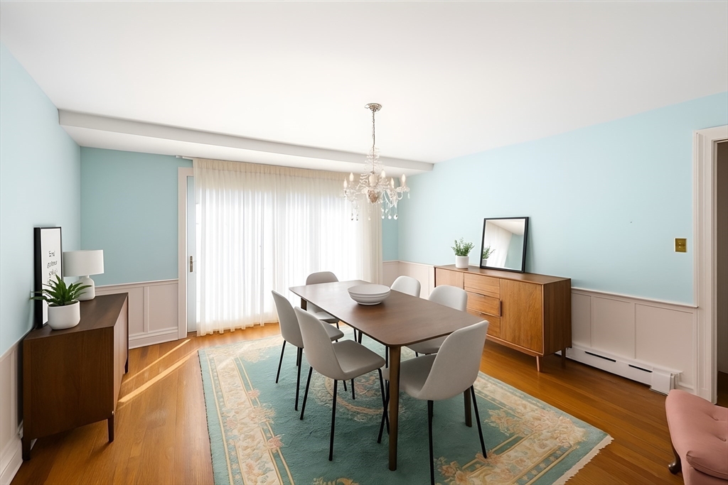751 Brook Road Milton, MA 02186 - Photo 6 of 20 a view of a dining room with furniture and wooden floor