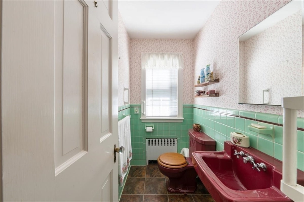 751 Brook Road Milton, MA 02186 - Photo 9 of 20 a bathroom with a toilet a sink and a mirror