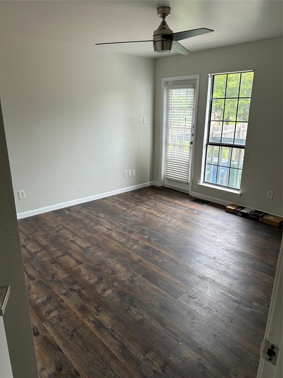 4520 Speedway, Unit A Austin, TX 78751 - Photo 8 of 9 Empty room with dark wood-style floors and a ceiling fan