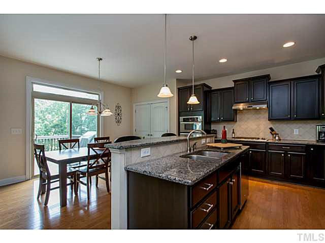 Kitchen CENTER ISLAND with SINK is a great PREP SPACE. Added seating for casual meals or a great place for the kids to do their homework. Kitchen