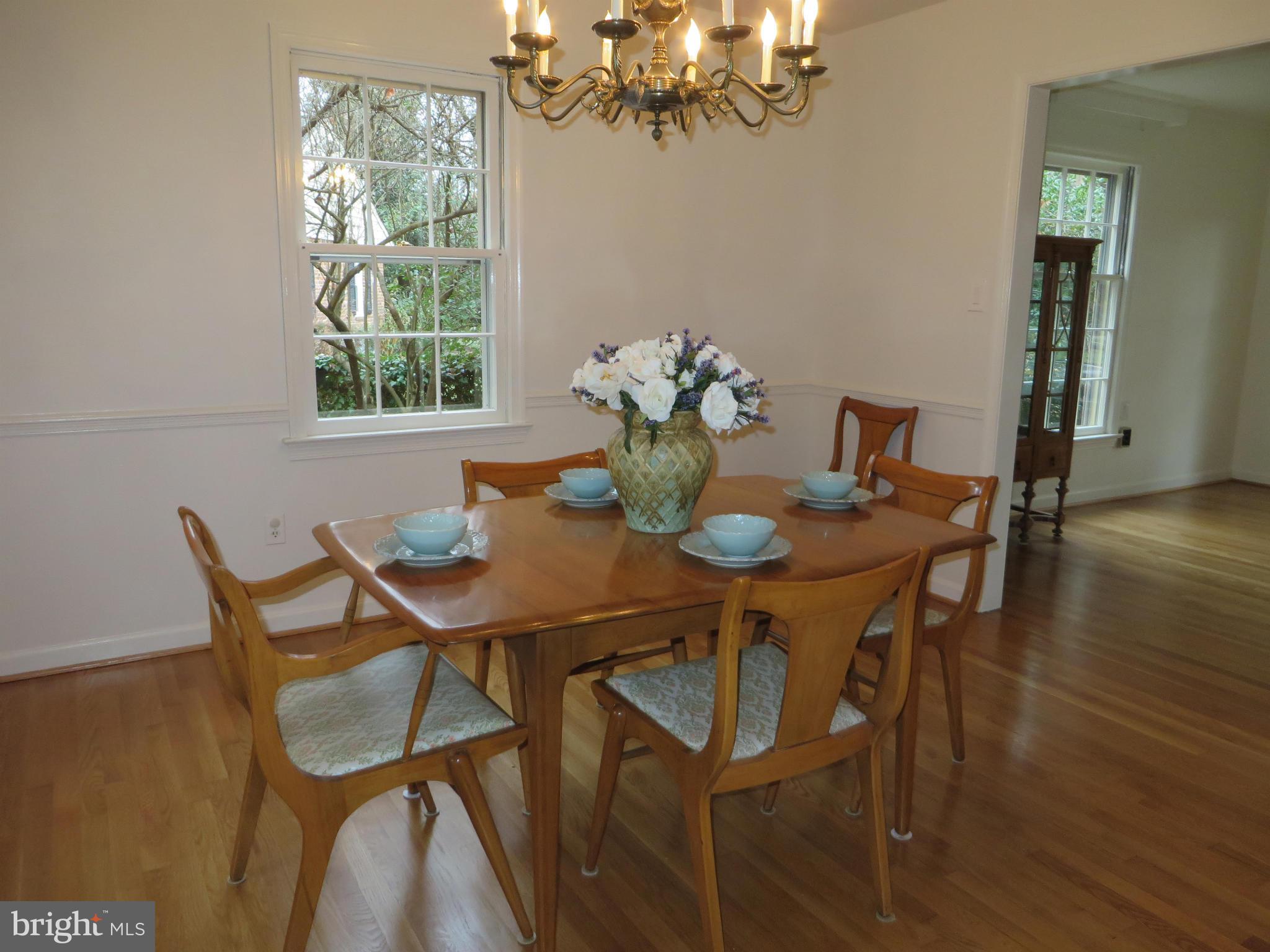 8425 Riverside Road Alexandria, VA 22308 - Photo 9 of 28 a view of a dining room with furniture and chandelier