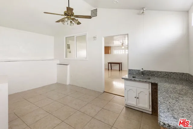 a view of cabinets and window
