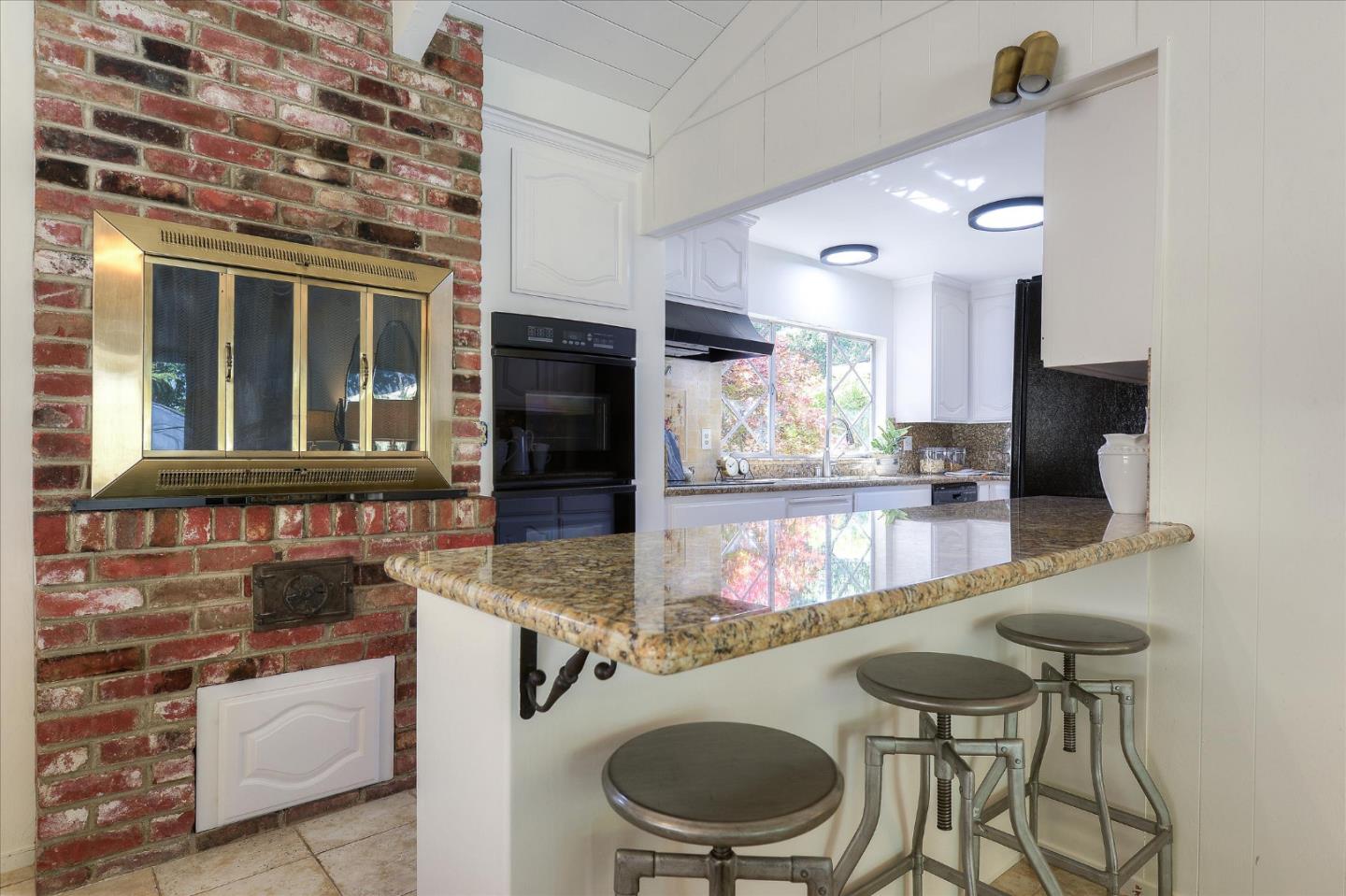 2620 Summit Drive Burlingame, CA 94010 - Photo 13 of 49 a kitchen with furniture and a stove