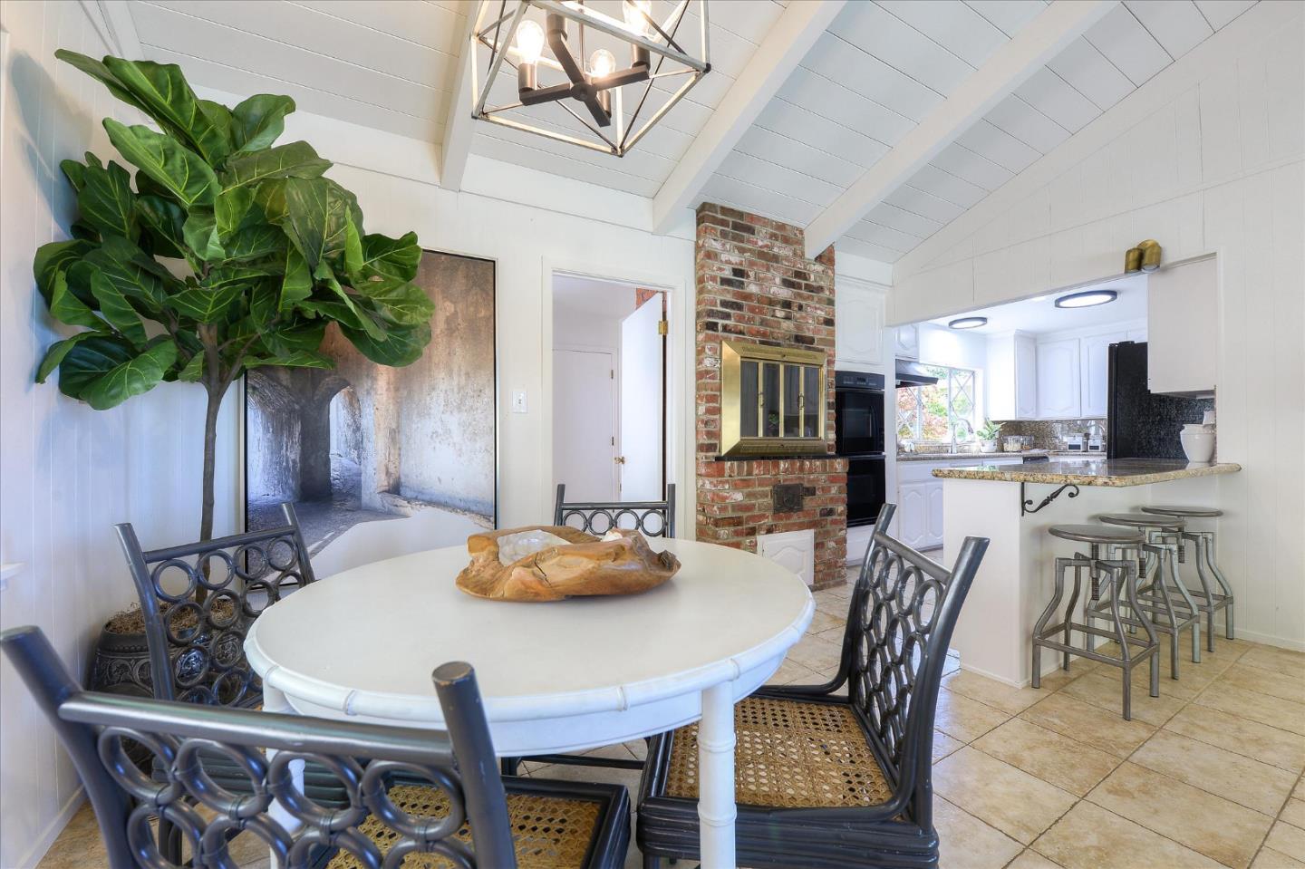 2620 Summit Drive Burlingame, CA 94010 - Photo 14 of 49 a view of a dining room with furniture and a potted plant
