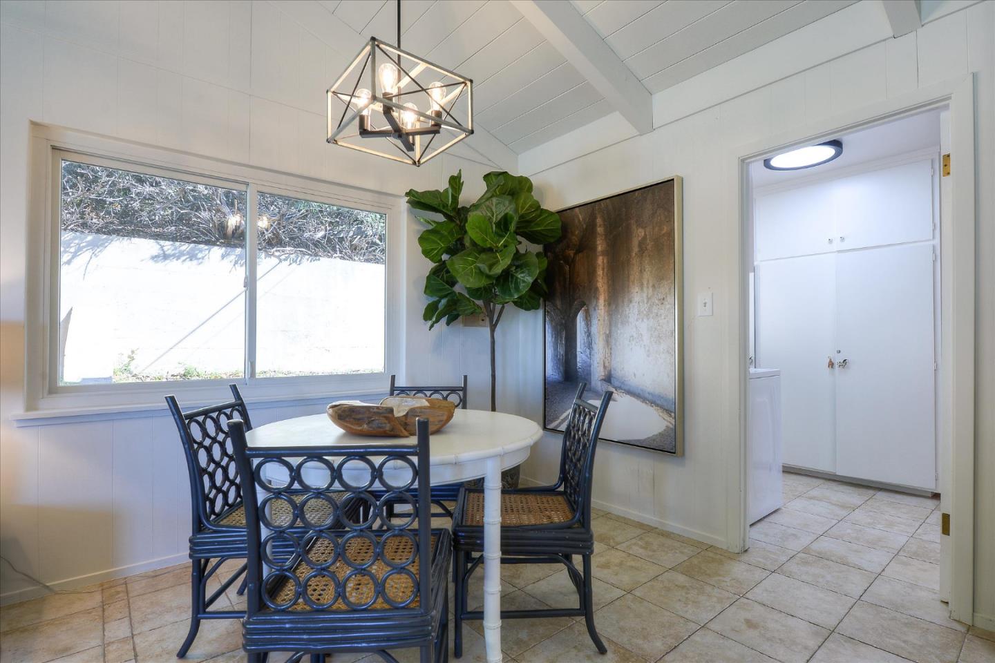 2620 Summit Drive Burlingame, CA 94010 - Photo 15 of 49 a dining room with furniture potted plants and wooden floor