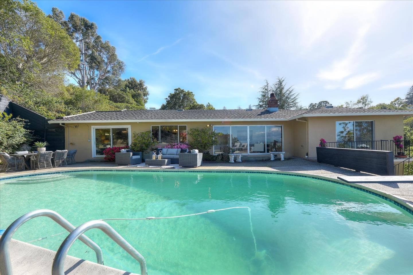 2620 Summit Drive Burlingame, CA 94010 - Photo 23 of 49 a view of a house with a yard porch and furniture