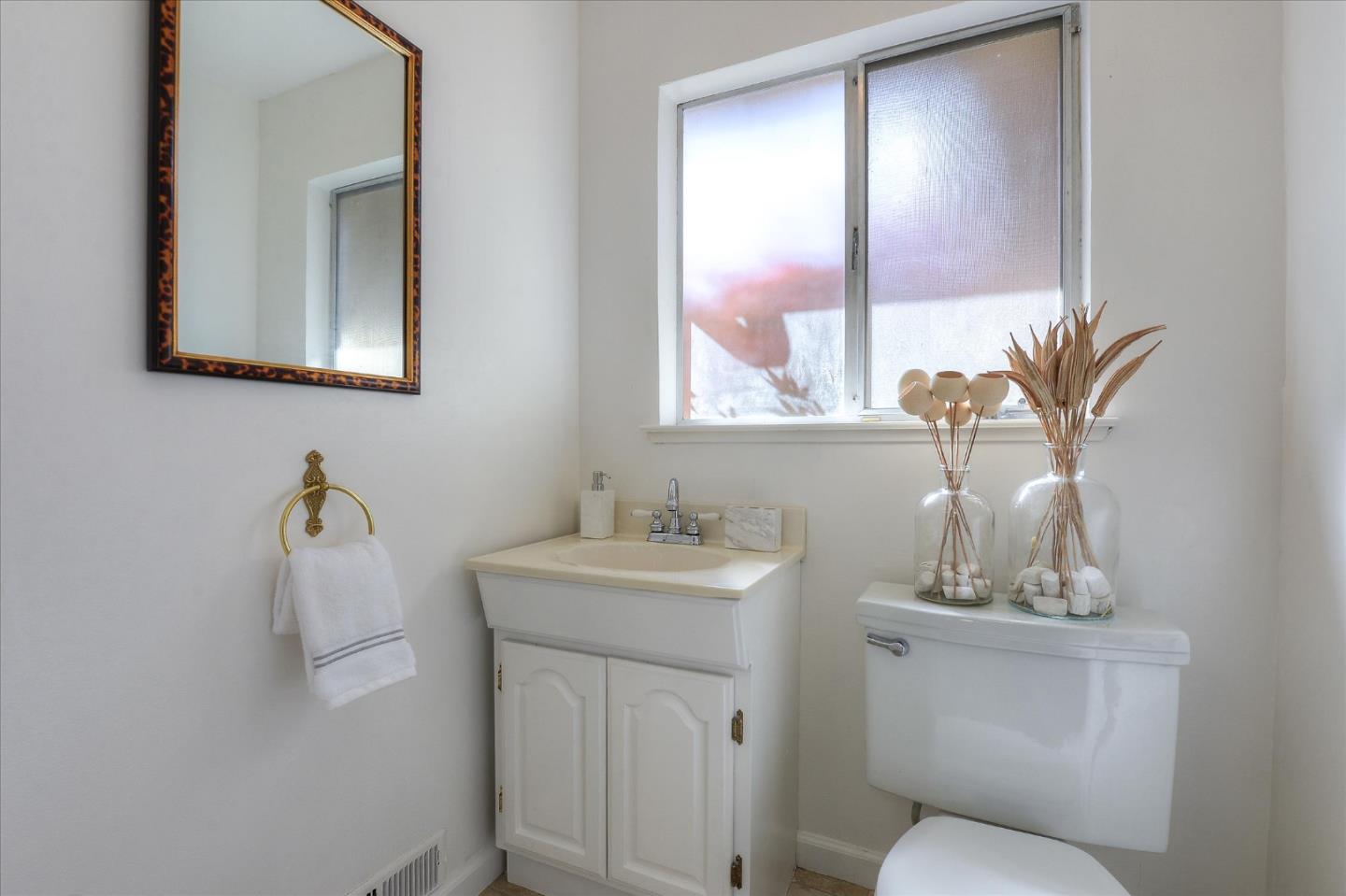 2620 Summit Drive Burlingame, CA 94010 - Photo 26 of 49 a bathroom with a toilet sink and mirror