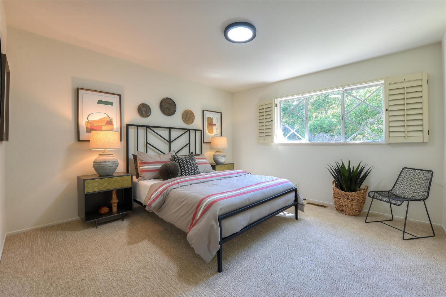 2620 Summit Drive Burlingame, CA 94010 - Photo 27 of 49 a bedroom with a bed and a table