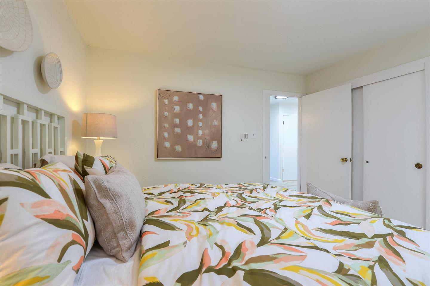 2620 Summit Drive Burlingame, CA 94010 - Photo 30 of 49 a bedroom with a bed and painting on the wall