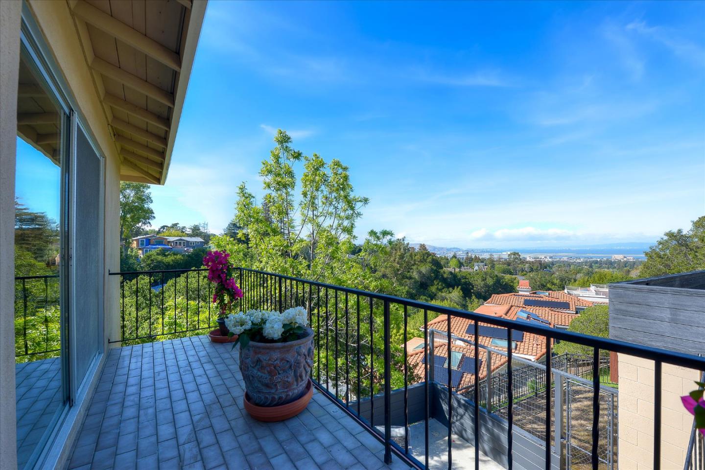 2620 Summit Drive Burlingame, CA 94010 - Photo 36 of 49 a view of a balcony with wooden floor and outdoor seating