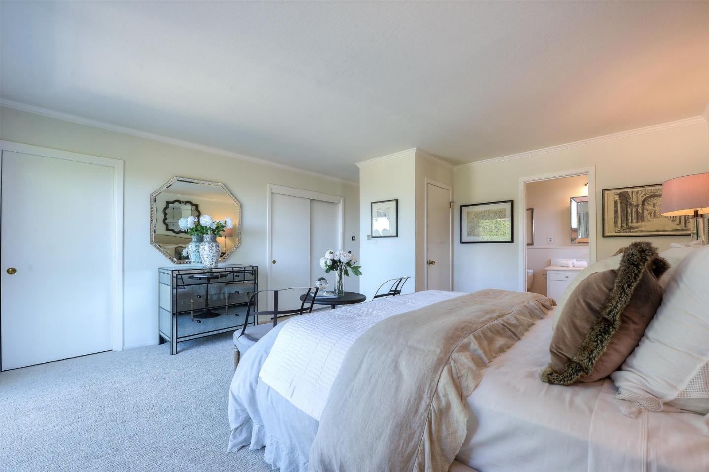 2620 Summit Drive Burlingame, CA 94010 - Photo 37 of 49 a bedroom with a bed a table and chair