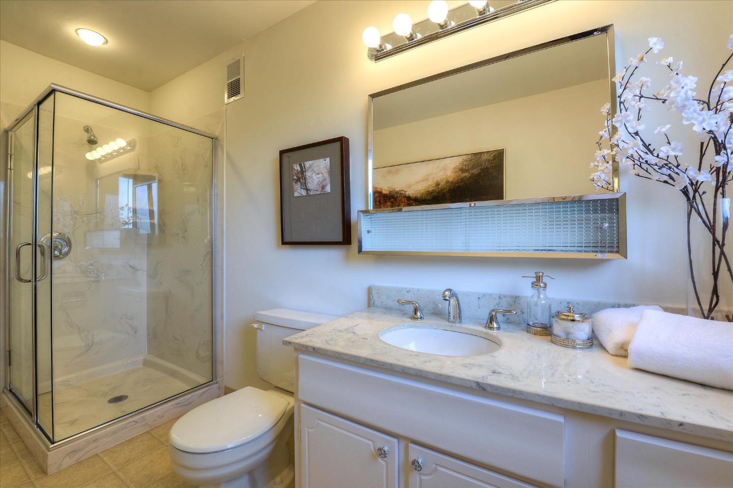 2620 Summit Drive Burlingame, CA 94010 - Photo 41 of 49 a bathroom with a granite countertop sink toilet and shower