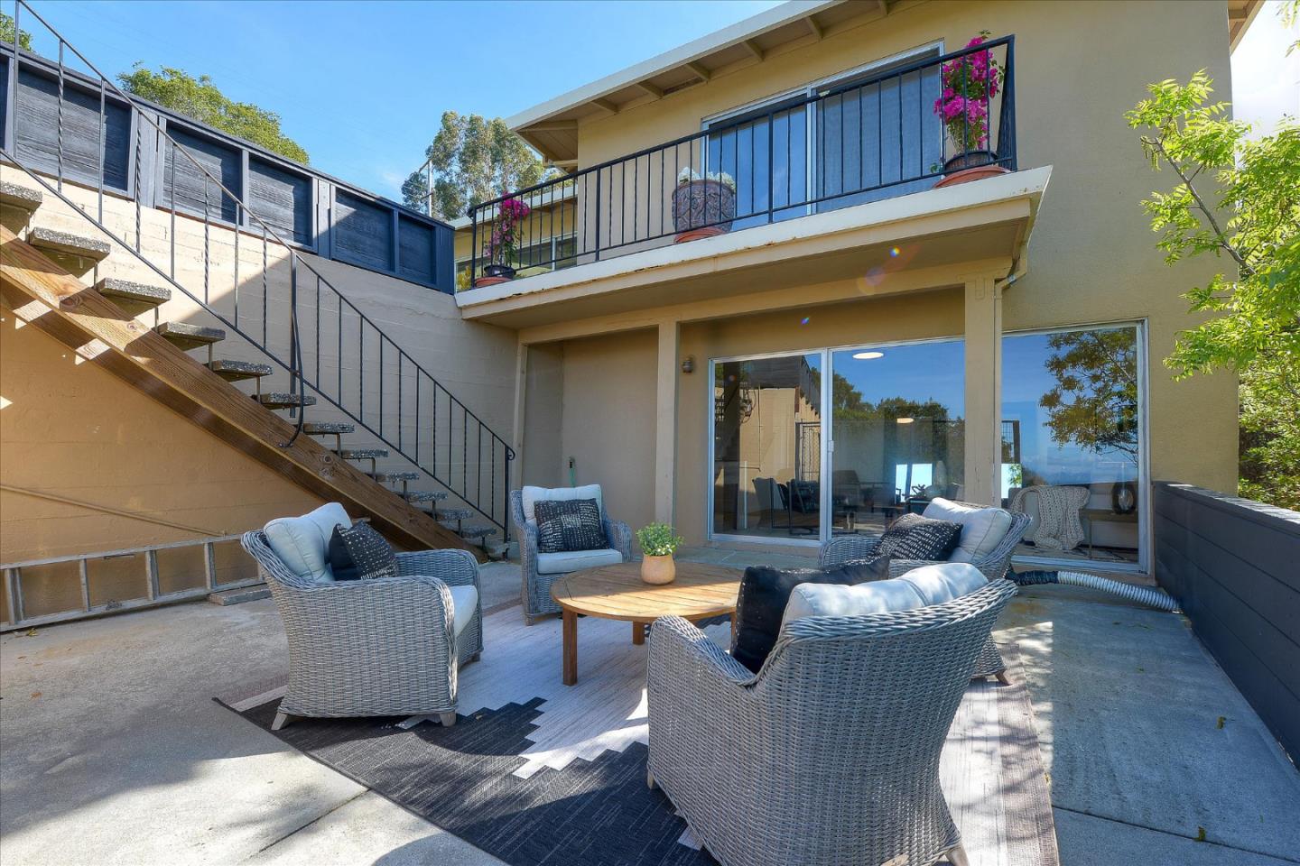 2620 Summit Drive Burlingame, CA 94010 - Photo 44 of 49 a view of a patio with couches table and chairs and potted plants