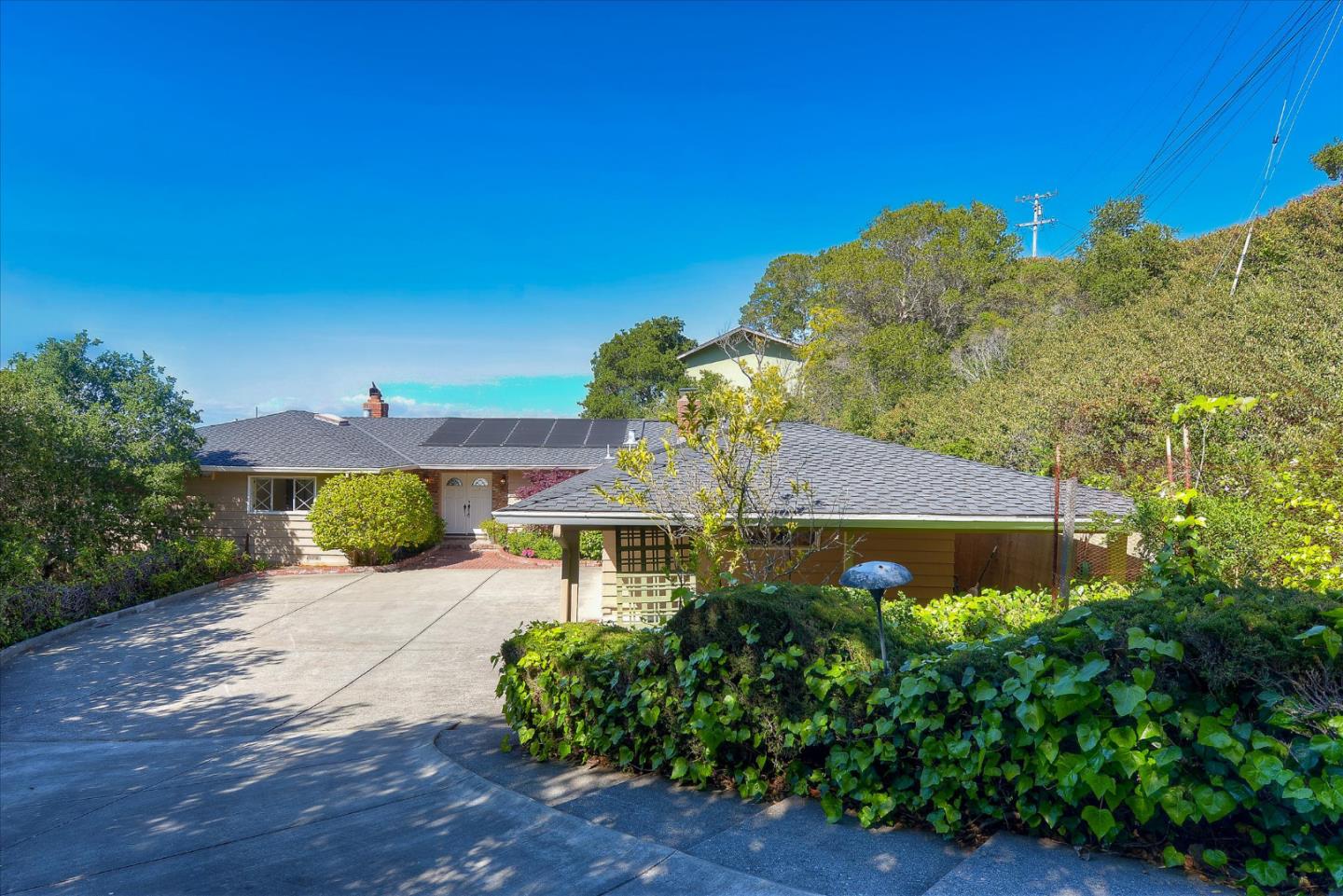 2620 Summit Drive Burlingame, CA 94010 - Photo 47 of 49 a front view of a house with a yard