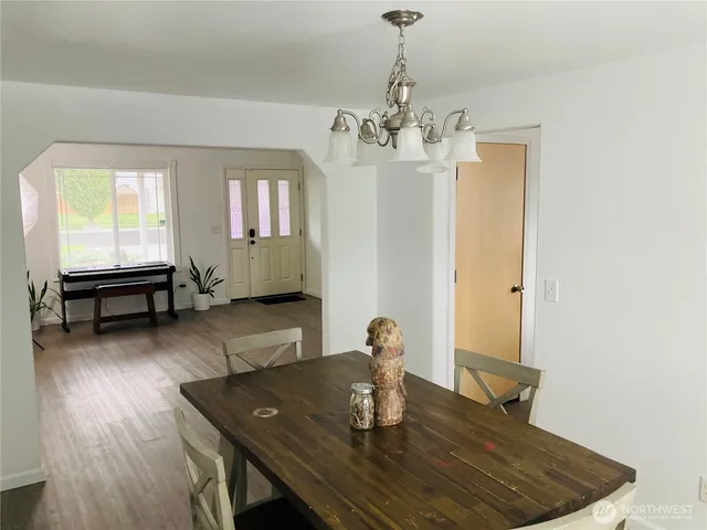 a living room with dining table