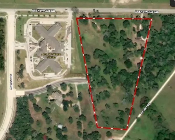 a flower garden in front of a glass door