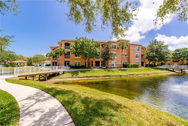 an aerial view of a houses with a swimming pool