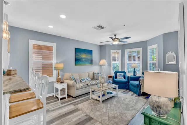 a large white kitchen with a table and chairs