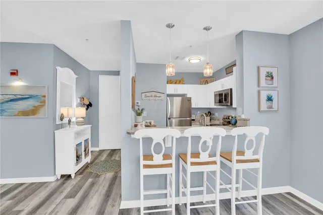 a living room with furniture a flat screen tv and a large window