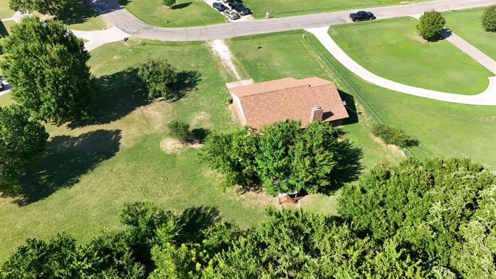 415 Meadowlark Trail Springtown, TX 76082 - Photo 33 of 40 an aerial view of a house with a yard and trees all around