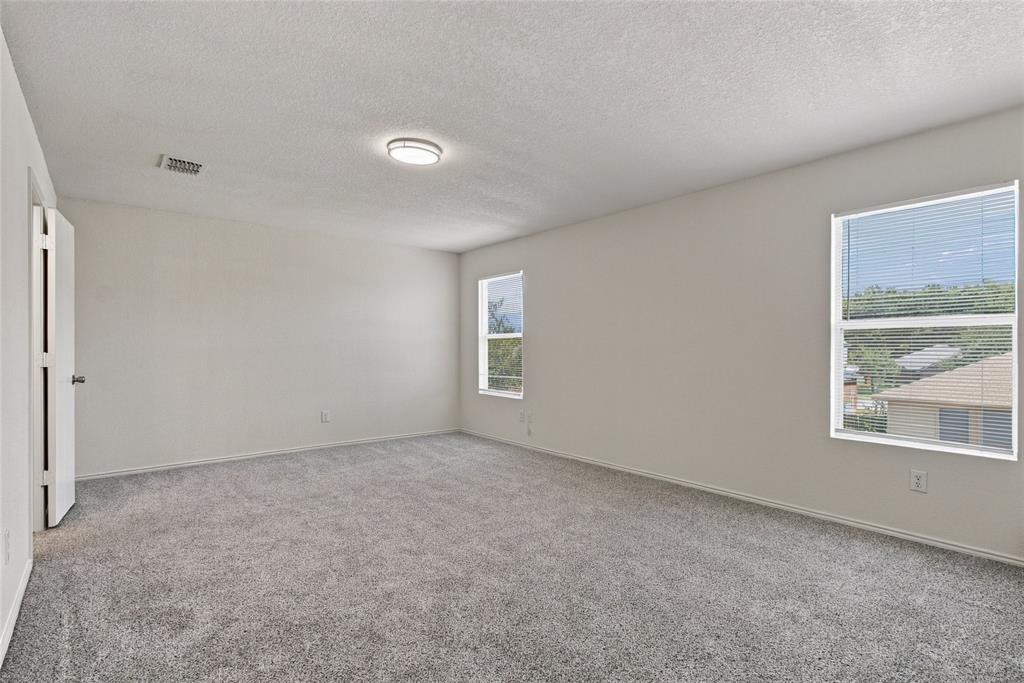 12121 Arbor Lake Road Rhome, TX 76078 - Photo 10 of 33 Large primary bedroom, with room for sitting area