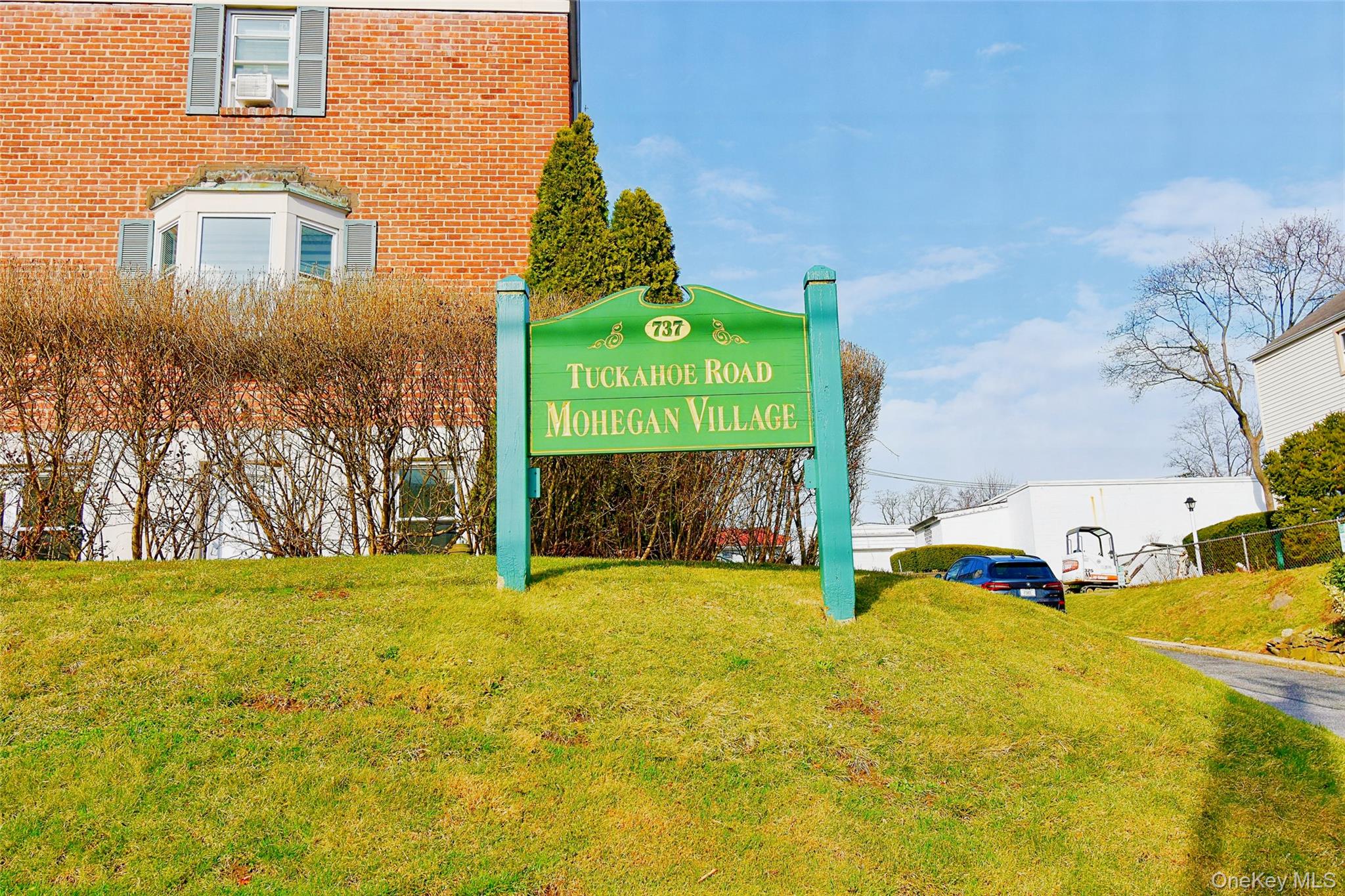 737 Tuckahoe Road, Unit 23 Yonkers, NY 10710 - Photo 12 of 12 a front view of a house with a yard