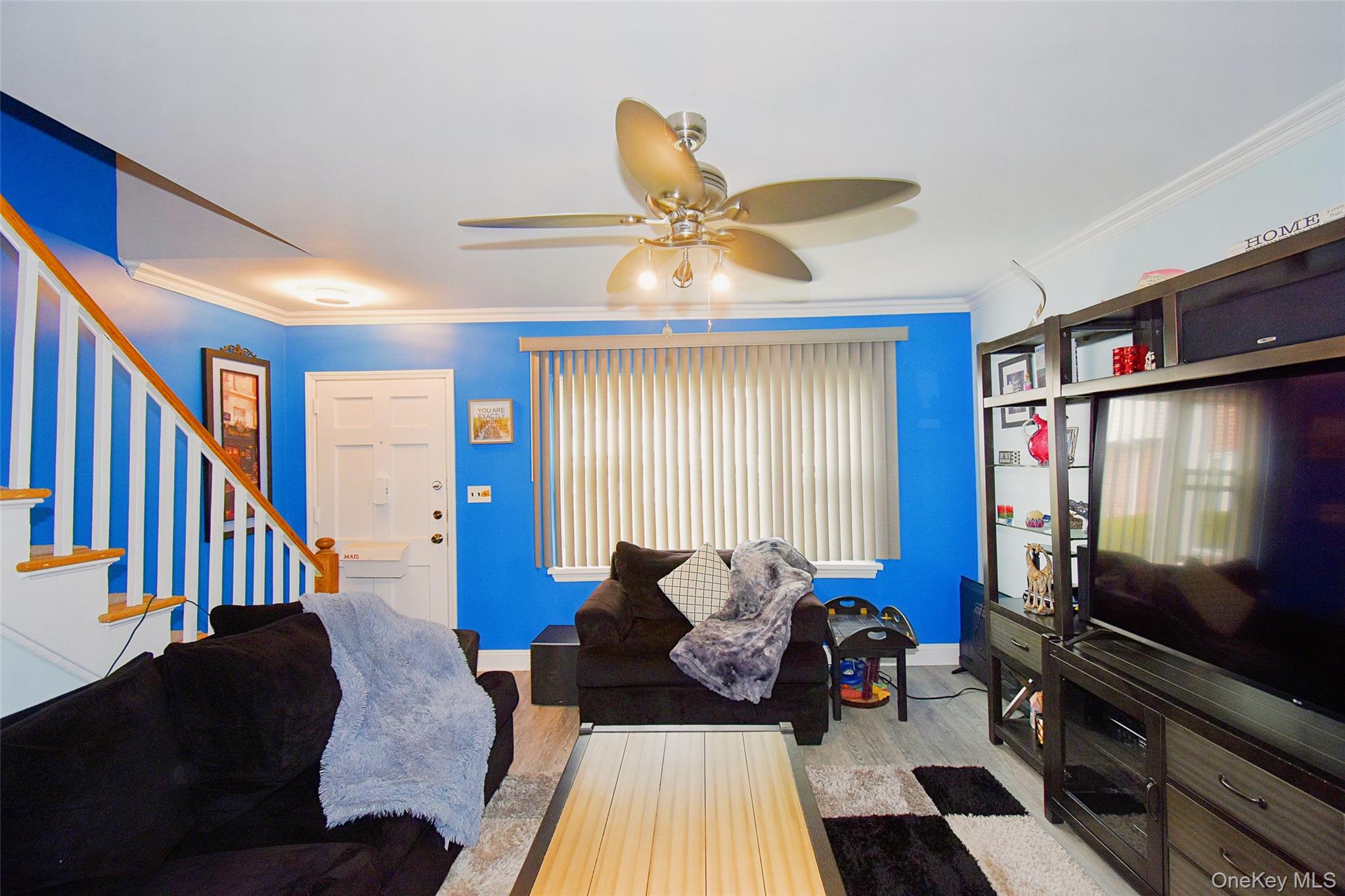 737 Tuckahoe Road, Unit 23 Yonkers, NY 10710 - Photo 2 of 12 a living room with furniture and a flat screen tv