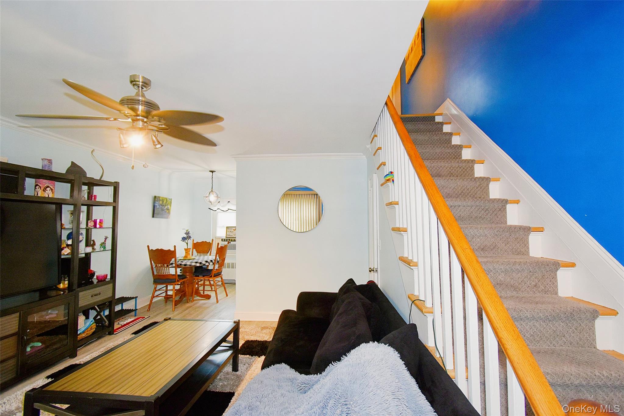 737 Tuckahoe Road, Unit 23 Yonkers, NY 10710 - Photo 3 of 12 a living room with furniture and a flat screen tv