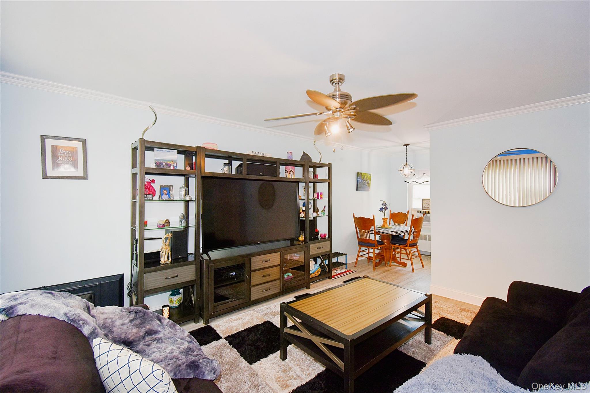 737 Tuckahoe Road, Unit 23 Yonkers, NY 10710 - Photo 4 of 12 a living room with furniture and a flat screen tv