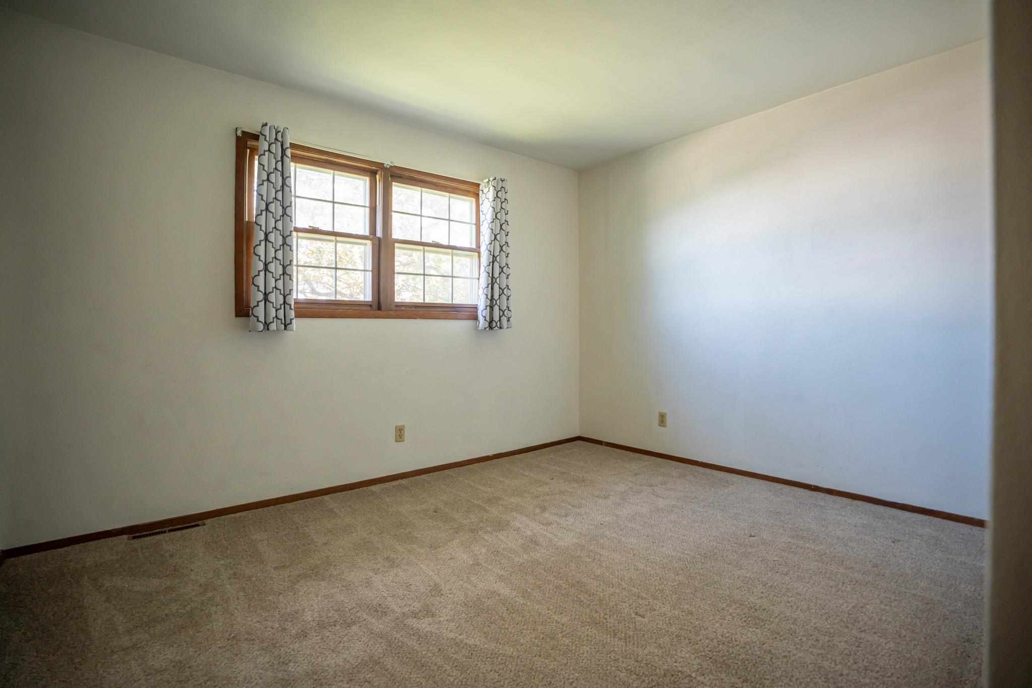 9092 East Scott Road Stillman Valley, IL 61084 - Photo 28 of 47 an empty room with a window