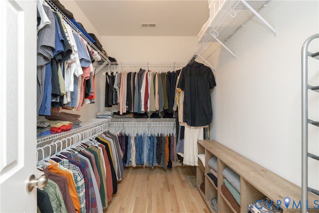 15618 Rowlett Road Chesterfield, VA 23838 - Photo 11 of 29 a view of walk in closet with clothes and shoes