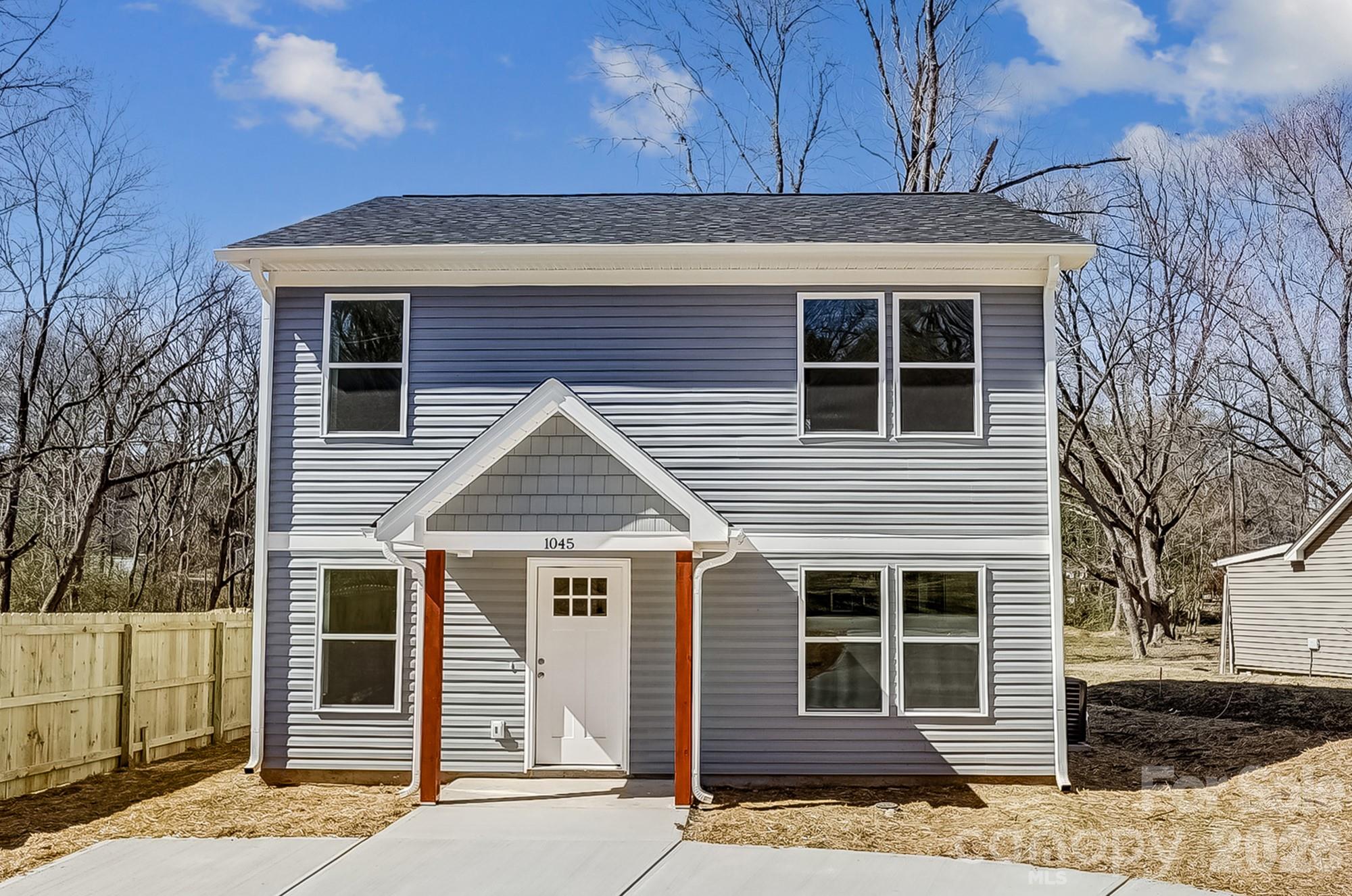 274 Bellhaven Place Northwest Concord, NC 28027 - Photo 1 of 27 a front view of a house with a garage