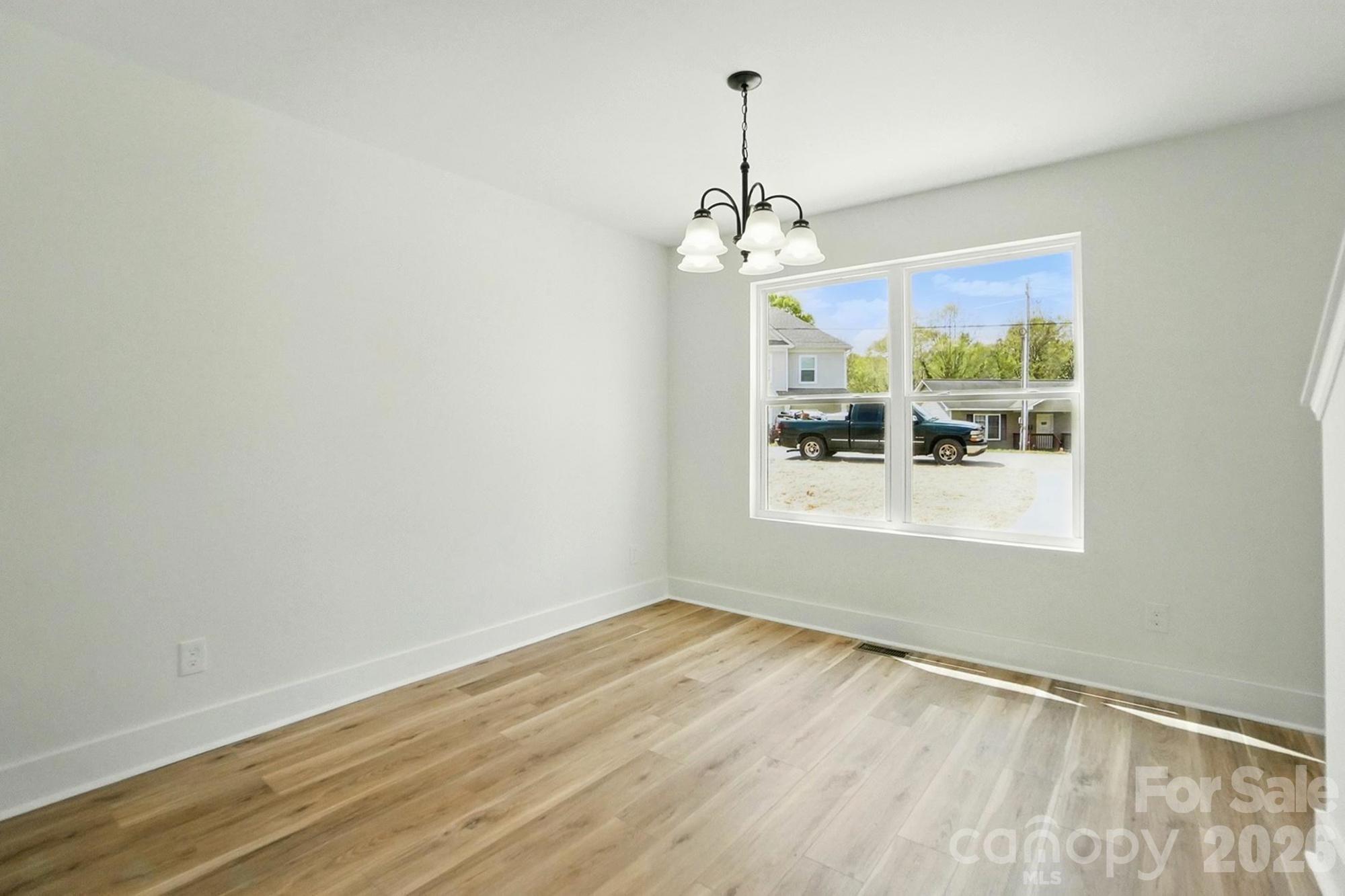 274 Bellhaven Place Northwest Concord, NC 28027 - Photo 11 of 27 a view of a windows and chandelier in a room