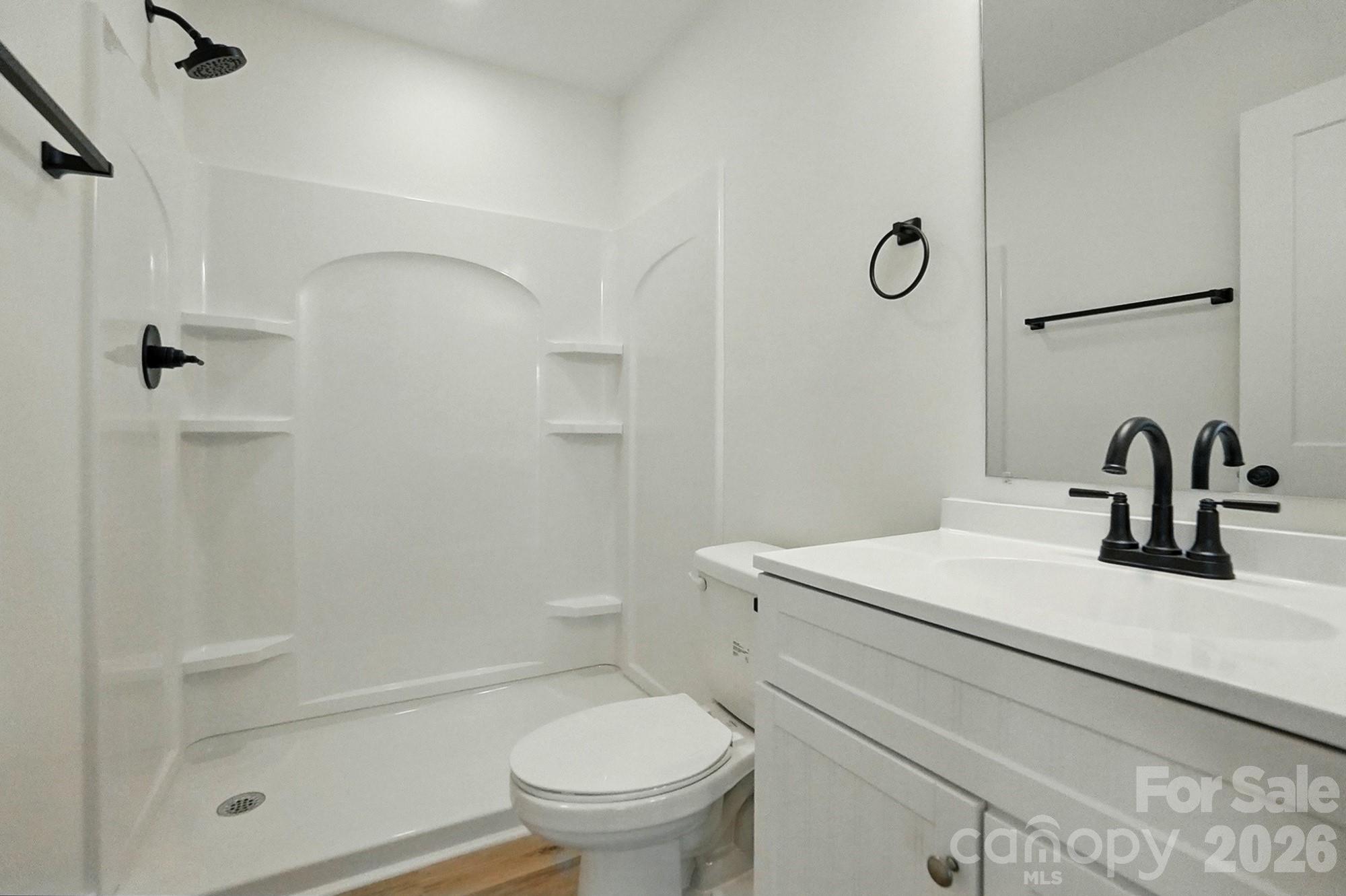 274 Bellhaven Place Northwest Concord, NC 28027 - Photo 20 of 27 a bathroom with a sink toilet and shower