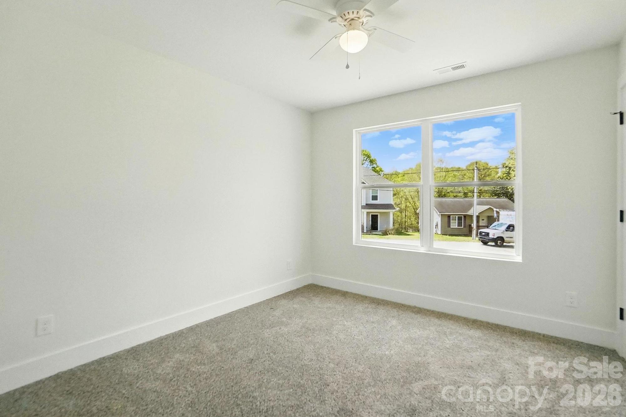 274 Bellhaven Place Northwest Concord, NC 28027 - Photo 21 of 27 an empty room with a window