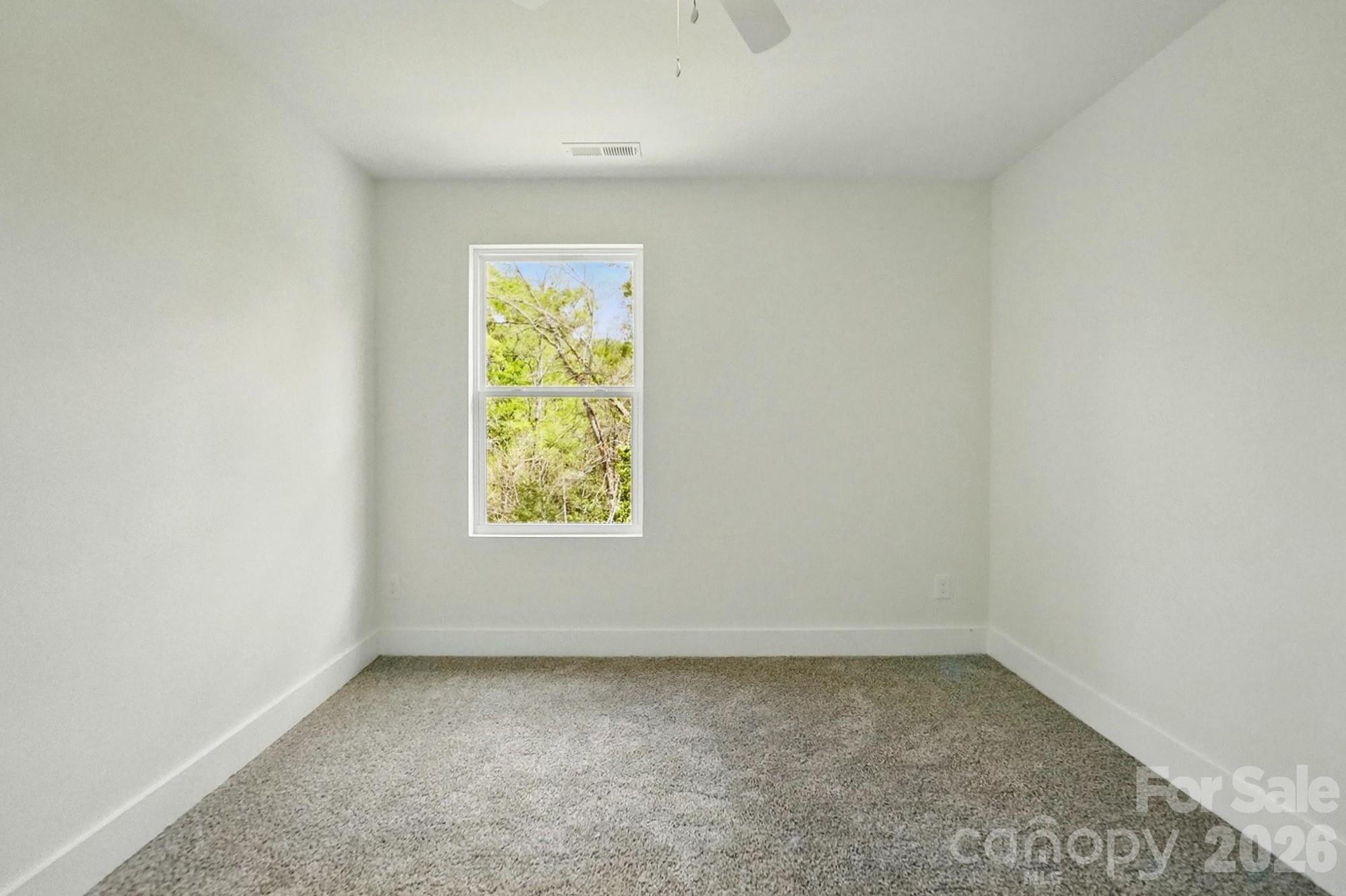 274 Bellhaven Place Northwest Concord, NC 28027 - Photo 25 of 27 an empty room with a window