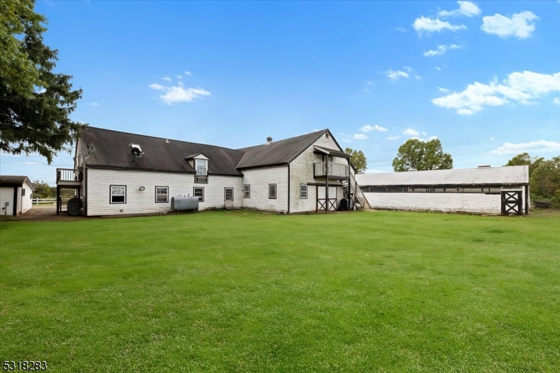 1850 Burnt Mills Road Bedminster, NJ 07921 - Photo 14 of 30 a view of a house with a big yard