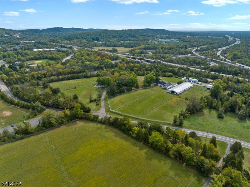 1850 Burnt Mills Road Bedminster, NJ 07921 - Photo 23 of 30 an aerial view of residential houses with outdoor space and river