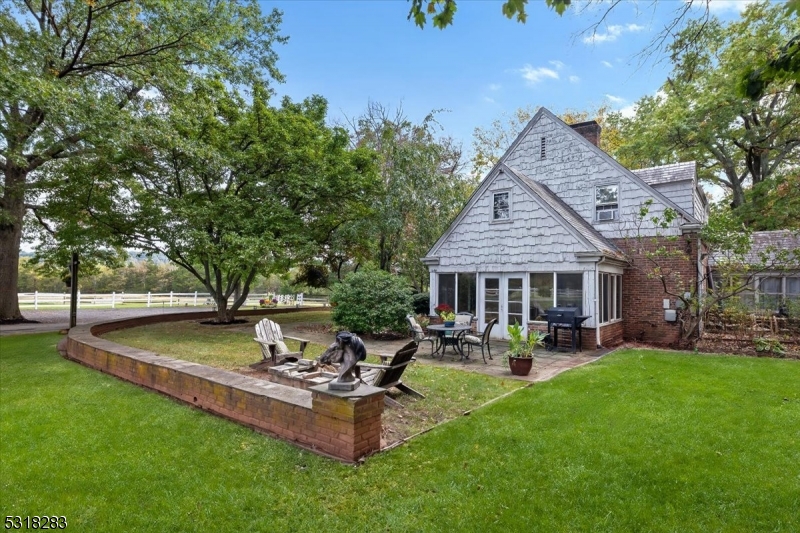 1850 Burnt Mills Road Bedminster, NJ 07921 - Photo 9 of 30 a view of a house with patio and a yard