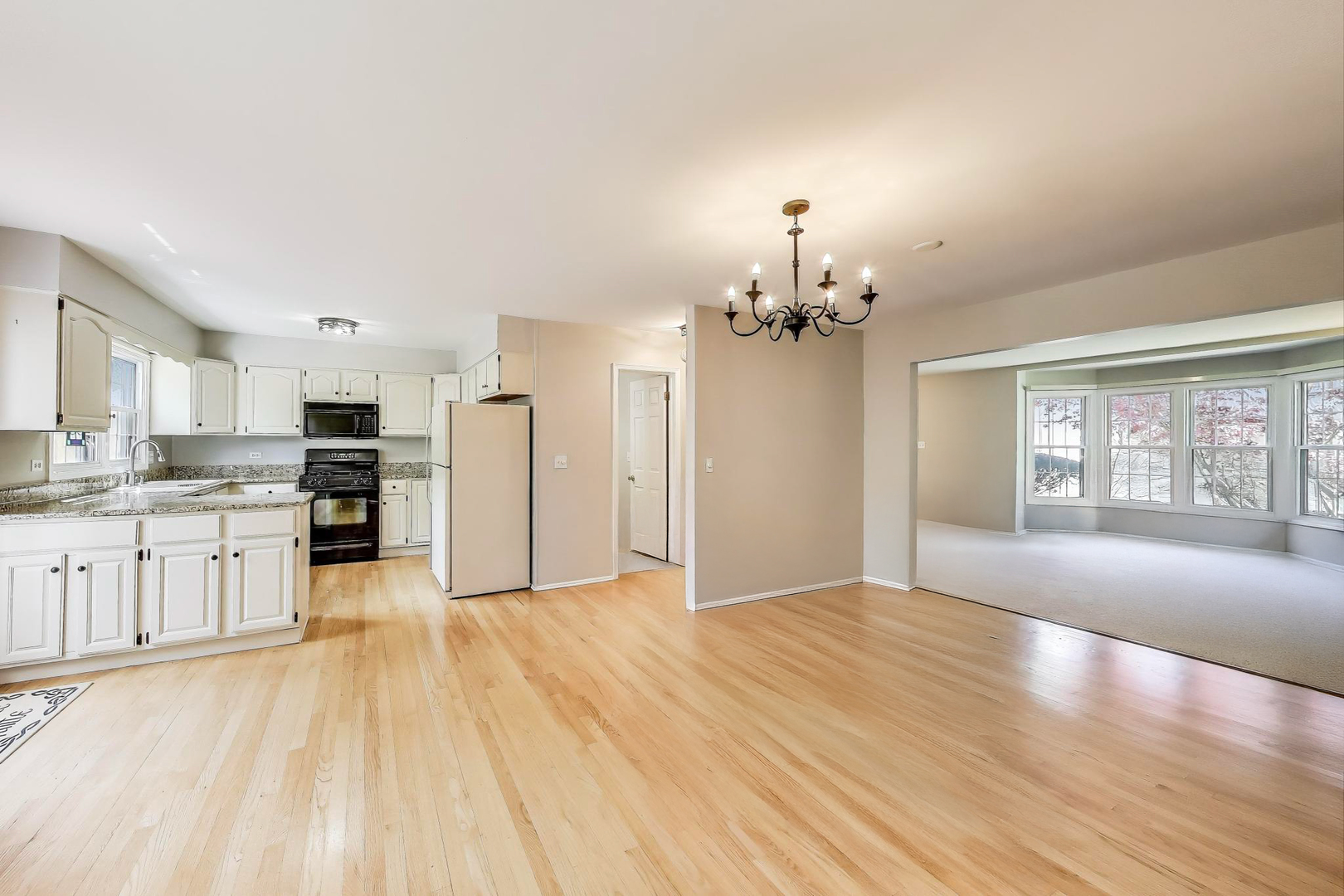 1022 Oakview Drive Wheaton, IL 60187 - Photo 5 of 20 a view of a kitchen with a sink a refrigerator and window