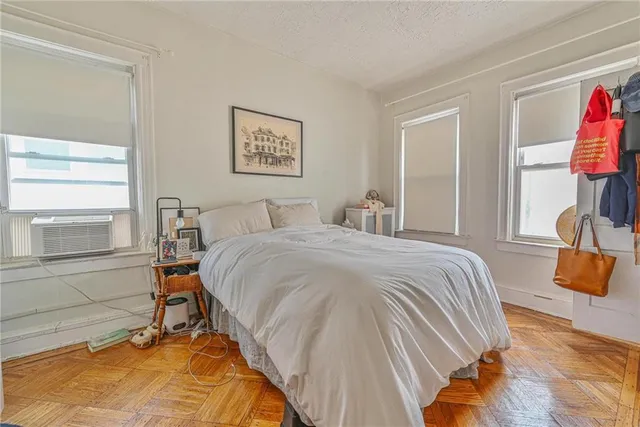 a bedroom with a bed and walk in closet