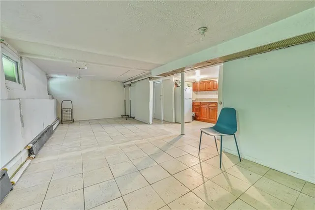 a view of room with furniture and a window