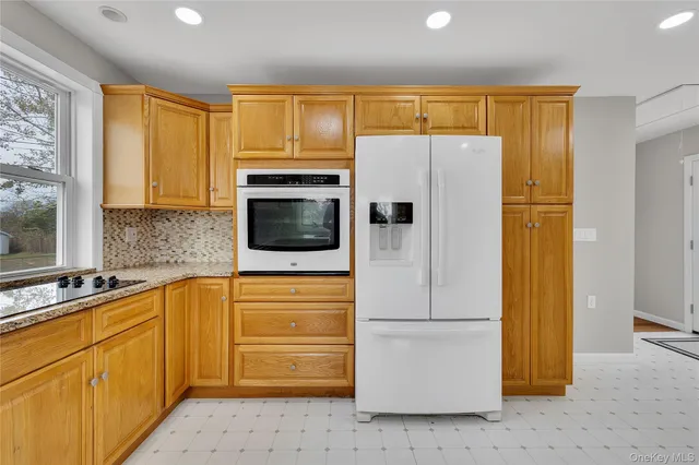 a kitchen with a refrigerator sink and microwave
