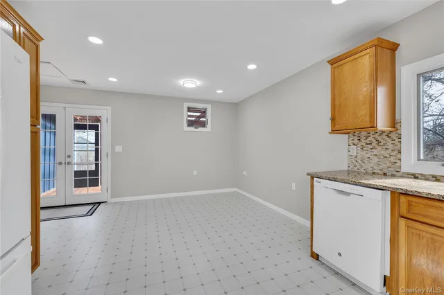 a view of a kitchen with a sink and a window