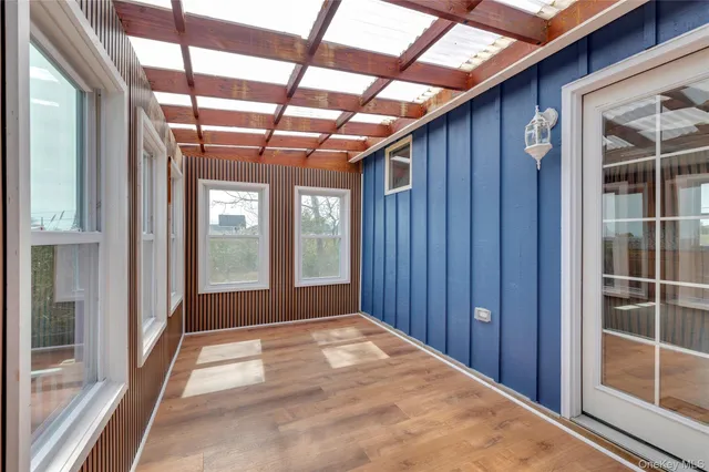 a view of a wooden balcony with wooden floor
