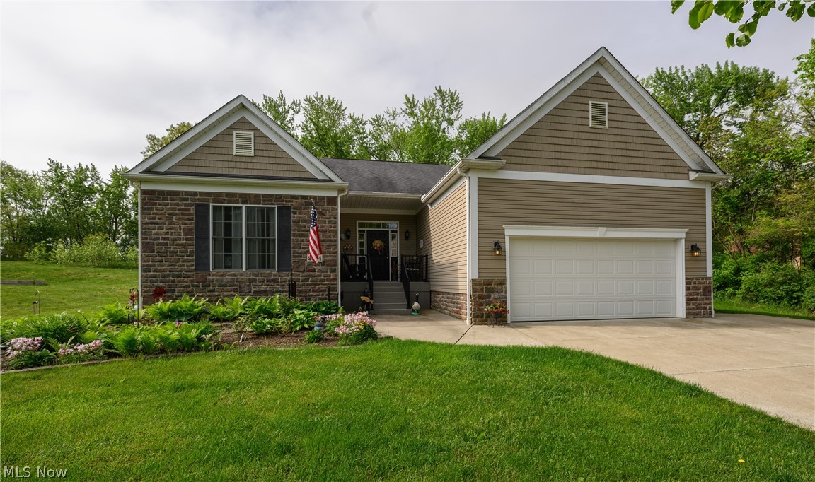 2664 Ridge Road Northwest Bolivar, OH 44612 - Photo 1 of 15 View of front of house featuring a garage and a front yard