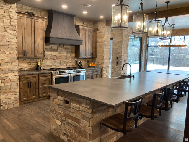 259 Meadow Drive Springville, UT 84663 - Photo 13 of 62 Kitchen with double oven range, a large island, a breakfast bar, and dark wood-style floors