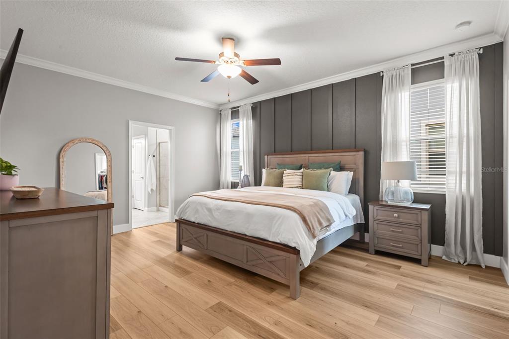 4465 Tubular Run Land O Lakes, FL 34638 - Photo 13 of 60 a bedroom with a bed and wooden floor